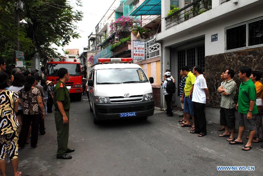 Ambulance arrive at an explosion site in Ho Chi Minh City, Vietnam, on Feb. 24, 2013. A total of seven people were confirmed dead and three went missing after three houses in a small alley in south Vietnam's Ho Chi Minh City's District 3 collapsed following two explosions at dawn on Sunday, said the police. (Xinhua/VNA)