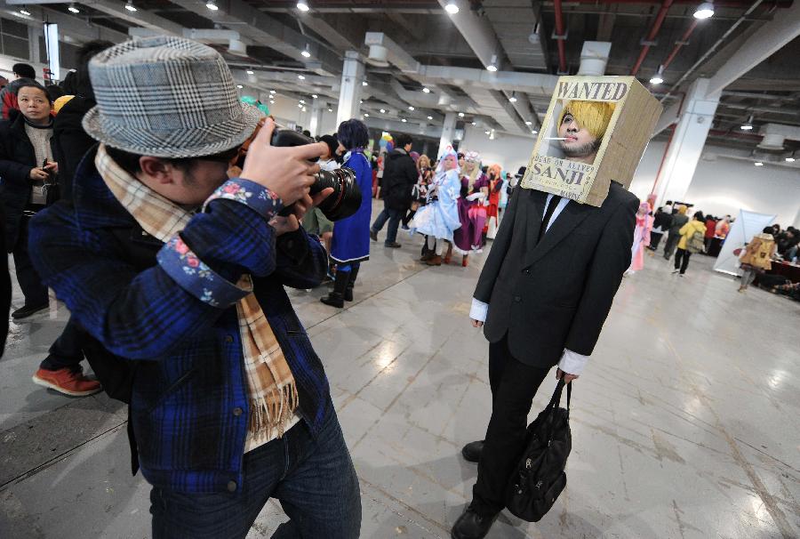 A cosplay enthusiast poses for a photo during the 12th Shanghai comic convention held at Shanghai World Expo Exhibition and Convention Center in Shanghai, east China, Feb. 23, 2013. (Xinhua/Lai Xinlin)