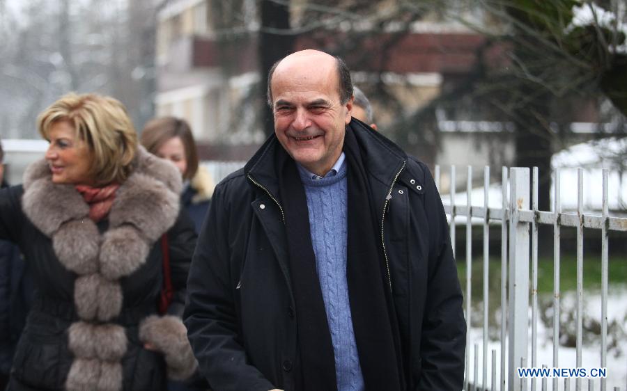  Italian center-left Democratic Party leader Pier Luigi Bersani arrives at a polling station to casts his vote in Piacenza, Italy, Feb. 24, 2013. Italians began voting for a new government Sunday, the outcome of which has had global markets and the country's European partners anxious about for weeks. (Xinhua/Alberto Lingria) 