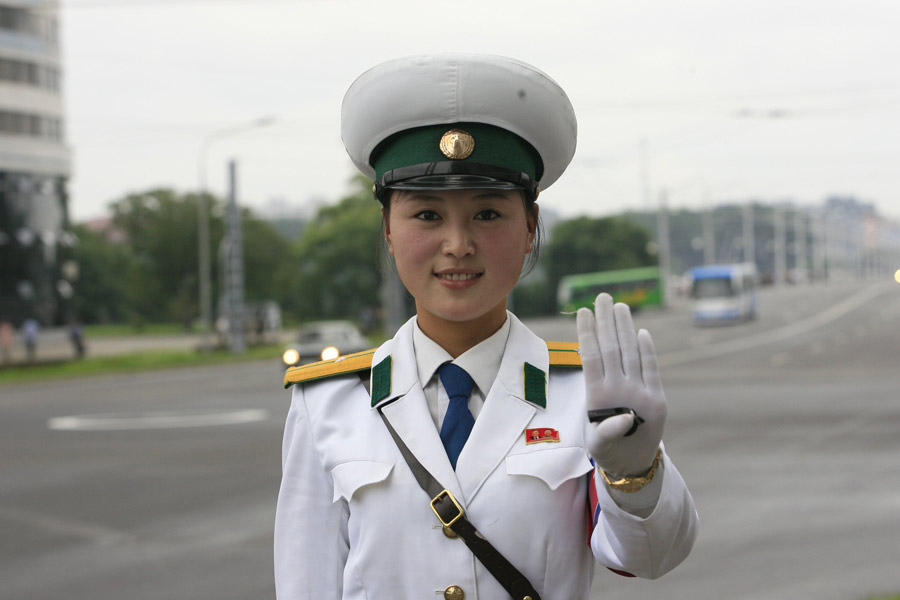 There may not be so many skyscrapers and modern automobiles on the streets in Pyongyang; however,there is one unique view in Pyongyang - the female traffic police officers. There are quite strict requirements to meet to be female traffic police officers in Pyongyang, for example, one's height must be over 163 centimeters. Every year 20 versatile candidates will be chosen from 16-year-old students. The government-paid makeups provided for them are from the best brands in Pyongyang. They must quit their job when they turn 26.(file photo)