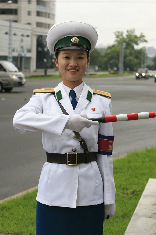 There may not be so many skyscrapers and modern automobiles on the streets in Pyongyang; however,there is one unique view in Pyongyang - the female traffic police officers. There are quite strict requirements to meet to be female traffic police officers in Pyongyang, for example, one's height must be over 163 centimeters. Every year 20 versatile candidates will be chosen from 16-year-old students. The government-paid makeups provided for them are from the best brands in Pyongyang. They must quit their job when they turn 26.(file photo)