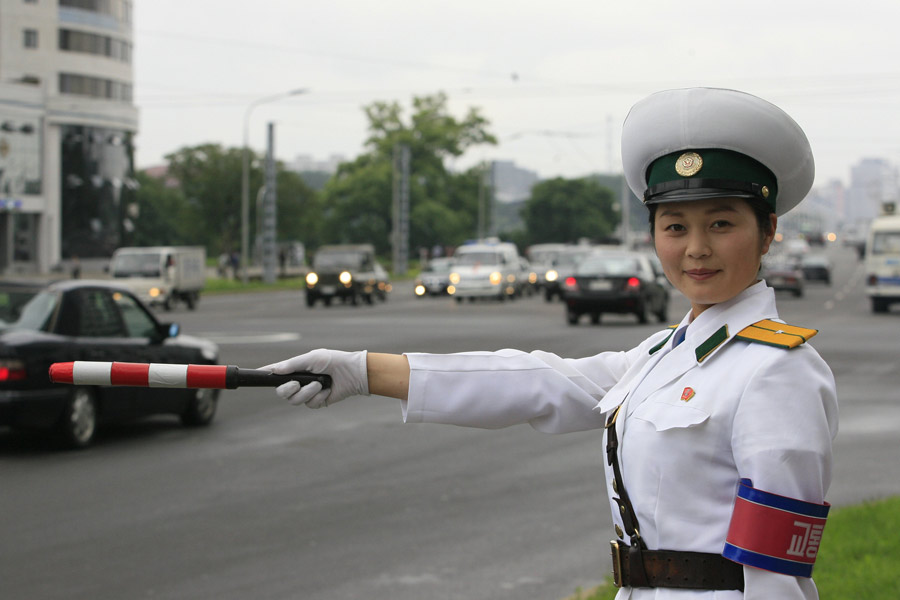 There may not be so many skyscrapers and modern automobiles on the streets in Pyongyang; however,there is one unique view in Pyongyang - the female traffic police officers. There are quite strict requirements to meet to be female traffic police officers in Pyongyang, for example, one's height must be over 163 centimeters. Every year 20 versatile candidates will be chosen from 16-year-old students. The government-paid makeups provided for them are from the best brands in Pyongyang. They must quit their job when they turn 26.(file photo)