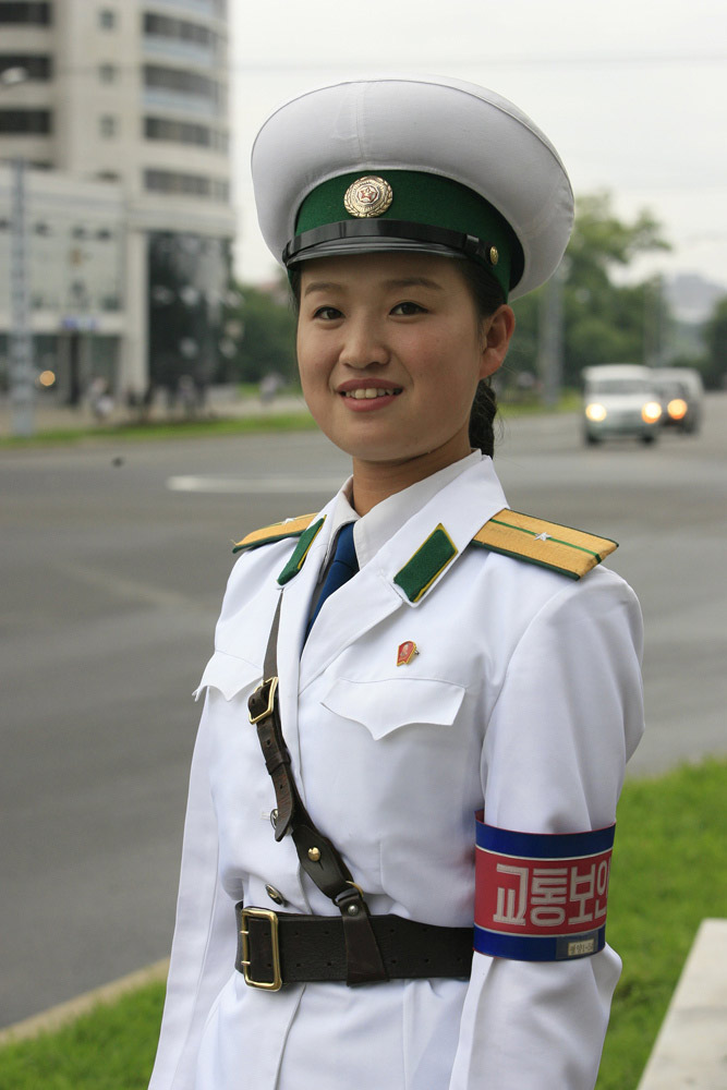 There may not be so many skyscrapers and modern automobiles on the streets in Pyongyang; however,there is one unique view in Pyongyang - the female traffic police officers. There are quite strict requirements to meet to be female traffic police officers in Pyongyang, for example, one's height must be over 163 centimeters. Every year 20 versatile candidates will be chosen from 16-year-old students. The government-paid makeups provided for them are from the best brands in Pyongyang. They must quit their job when they turn 26.(file photo)