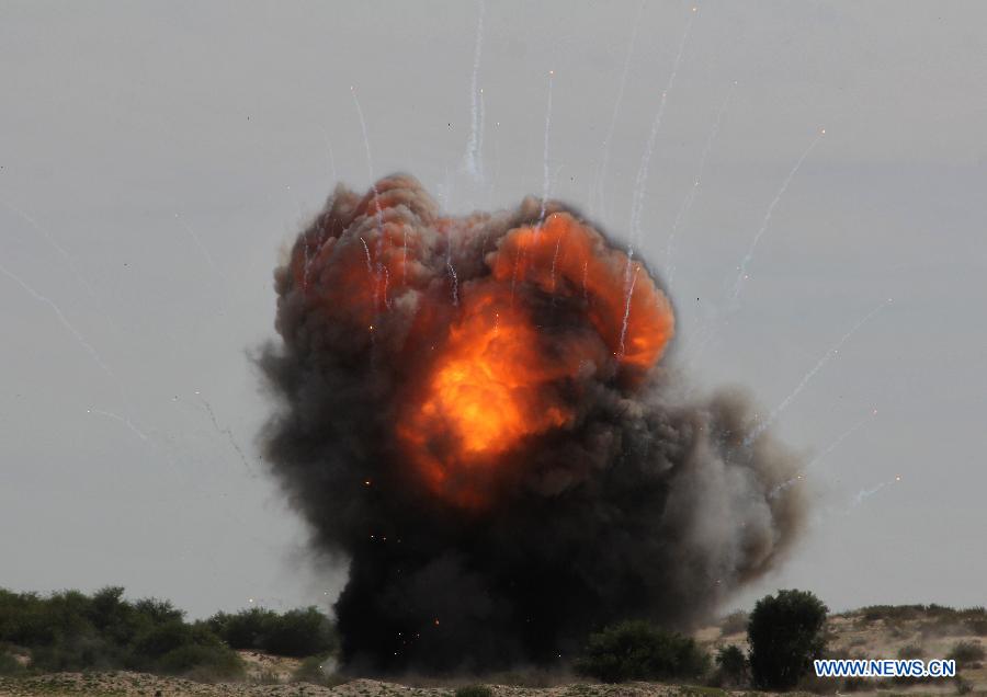 Unexploded Israeli missiles that landed on Gaza on Nov. 2012 are detonated during a demolishment event by Hamas security members in the southern Gaza Strip city of Rafah on Feb. 25, 2013. (Xinhua/Khaled Omar) 