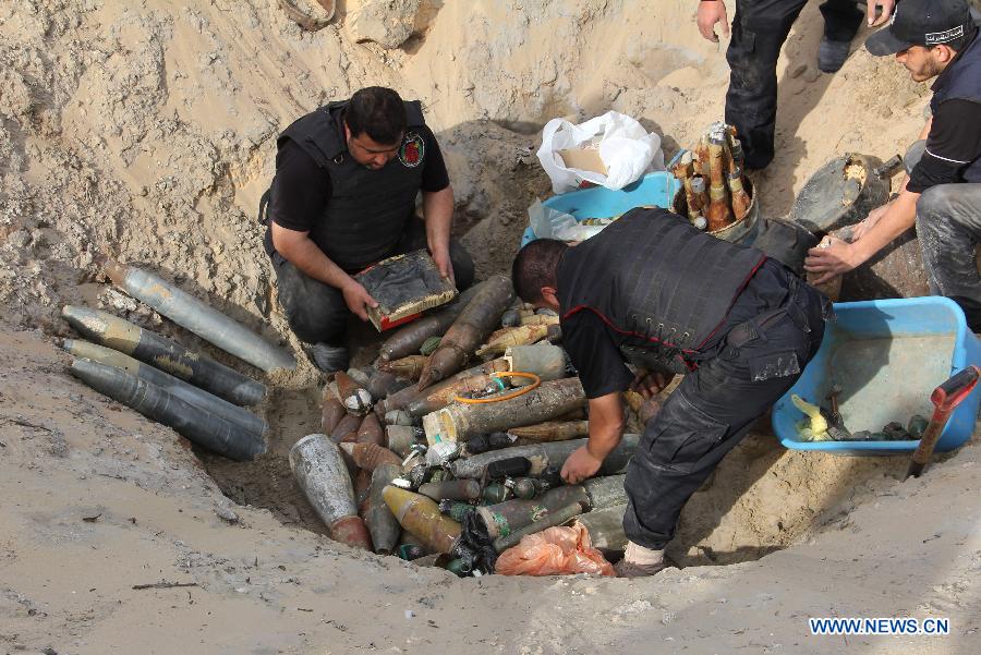 Palestinian security members of Hamas put together unexploded Israeli missiles that landed on Gaza on Nov. 2012 before a demolishment event in the southern Gaza Strip city of Rafah on Feb. 25, 2013. (Xinhua/Khaled Omar) 