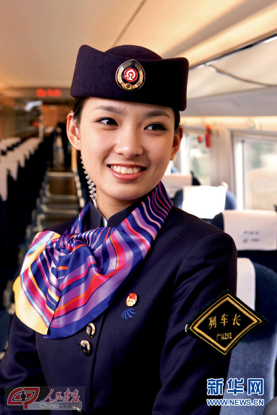 A beautiful train conductor. (Photo/Xinhua)