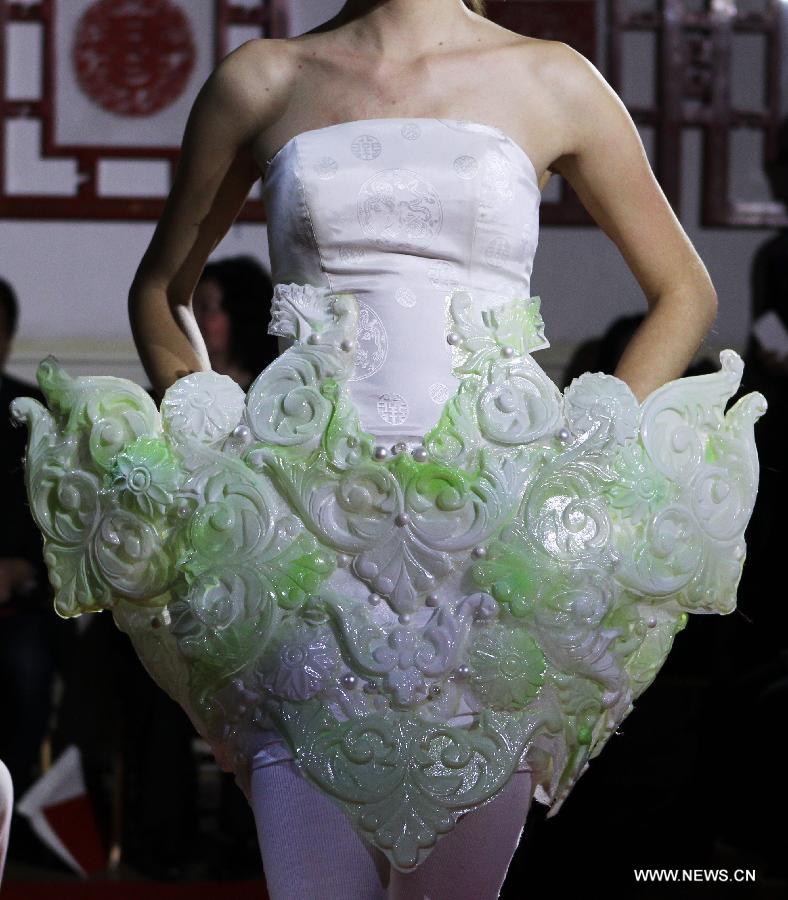 A model displays a creation by Chinese designer Xu Ming at Chinese Cultural Center in Paris, France, Feb. 25, 2013. (Xinhua/Gao Jing)