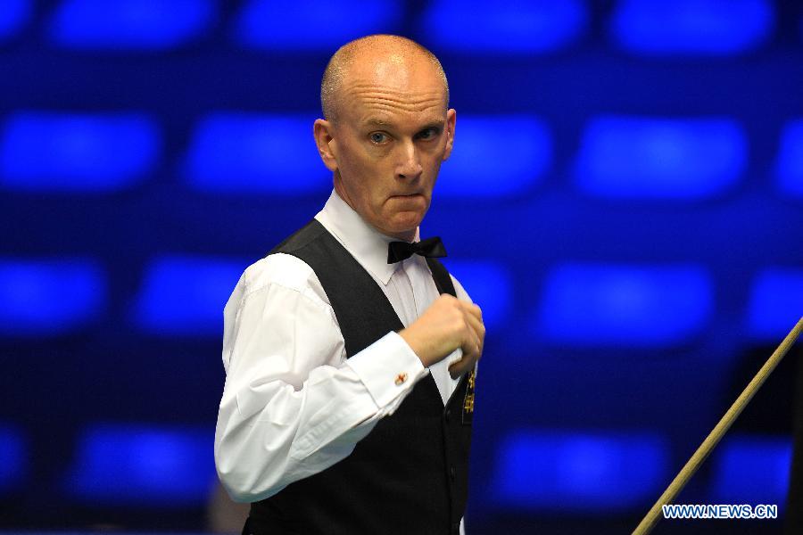 Peter Ebdon of England reacts during the first round match against Ricky Walden of England at the Haikou World Open snooker tournament in Haikou, capital of south China's Hainan Province, Feb. 25, 2013. Walden won 5-2. (Xinhua/Guo Cheng)