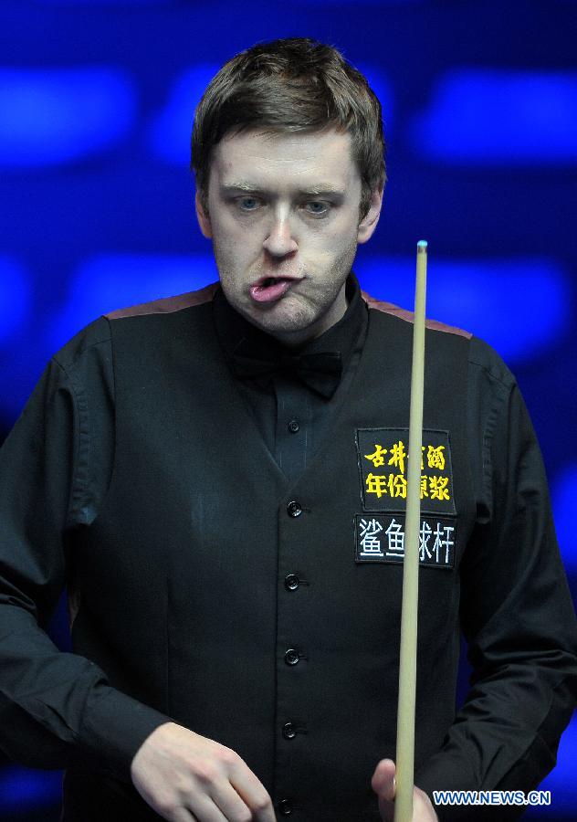 Ricky Walden of England reacts during the first round match against Peter Ebdon of England at the Haikou World Open snooker tournament in Haikou, capital of south China's Hainan Province, Feb. 25, 2013. Walden won 5-2. (Xinhua/Guo Cheng)