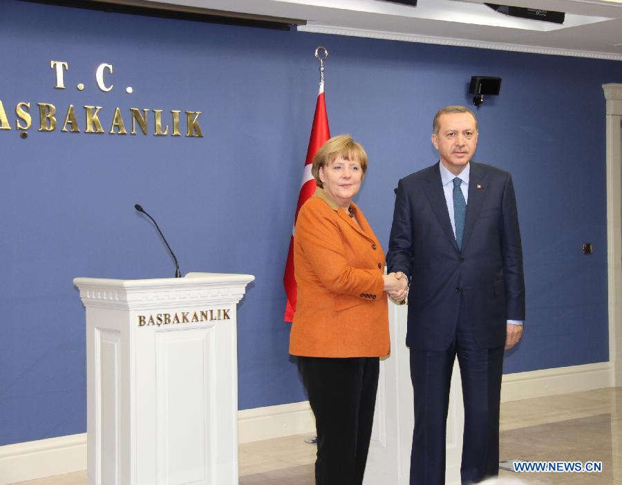 Turkish Prime Minister Recep Tayyip Erdogan (R) attends a joint press conference with visiting German Chancellor Angela Merkel after their meeting in Ankara, Turkey, Feb. 25, 2013. (Xinhua/Li Ming) 