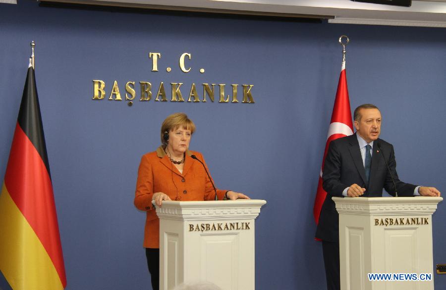 Turkish Prime Minister Recep Tayyip Erdogan (R) attends a joint press conference with visiting German Chancellor Angela Merkel after their meeting in Ankara, Turkey, Feb. 25, 2013. (Xinhua/Li Ming) 