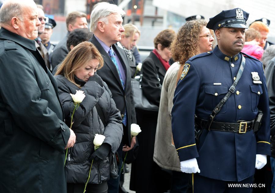 Family members of victims of the 1993 World Trade Center bombing attack participate in the 20th anniversary ceremony at Ground Zero in New York City on Feb. 26, 2013. The bomb explosion with the force of an earthquake rocked the building, killing 6 people and injuring more than 1,000. (Xinhua/Wang Lei) 