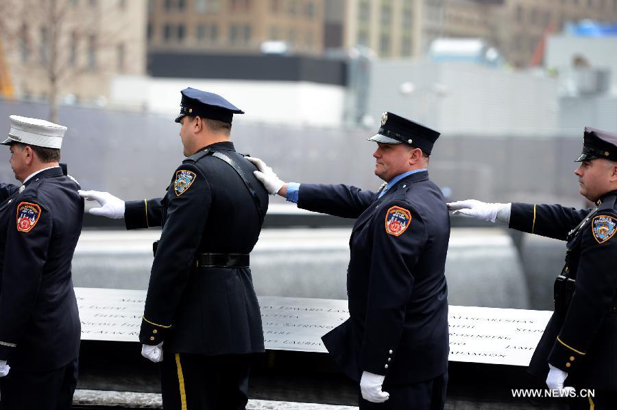 Police officers participate in the 20th anniversary ceremony to commemorate victims of the 1993 World Trade Center bombing attack, at Ground Zero in New York City on Feb. 26, 2013. The bomb explosion with the force of an earthquake rocked the building, killing 6 people and injuring more than 1,000. (Xinhua/Wang Lei) 
