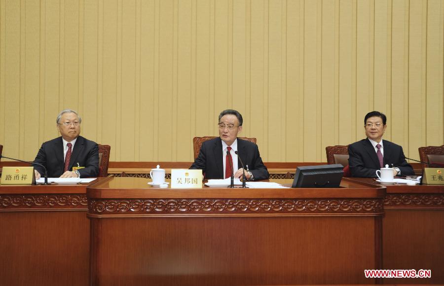 Wu Bangguo (C), chairman of the National People's Congress (NPC) Standing Committee, presides over the closing ceremony of the 31st session of the 11th NPC Standing Committee in Beijing, capital of China, Feb. 27, 2013. (Xinhua/Xie Huanchi)