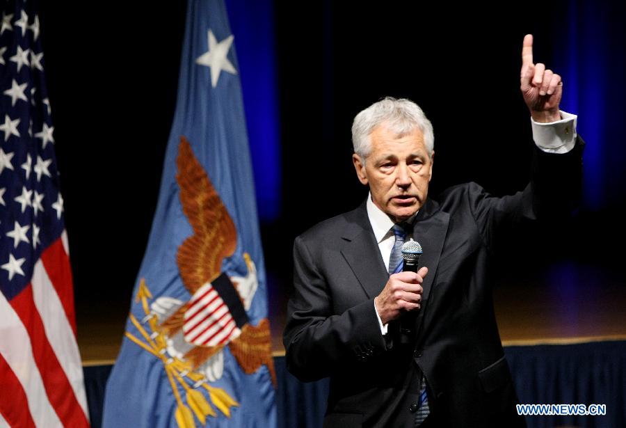 U.S. Defense Secretary Chuck Hagel speaks to Defense Department employees at the staff meeting after he was sworn in as the new Pentagon chief at the Pentagon, Feb. 27, 2013. In remarks to Defense Department employees, he deplored the uncertainty brought about by impending automatic cuts to the defense budget, and promised to do everything in his power to meet those challenges. (Xinhua/Fang Zhe)