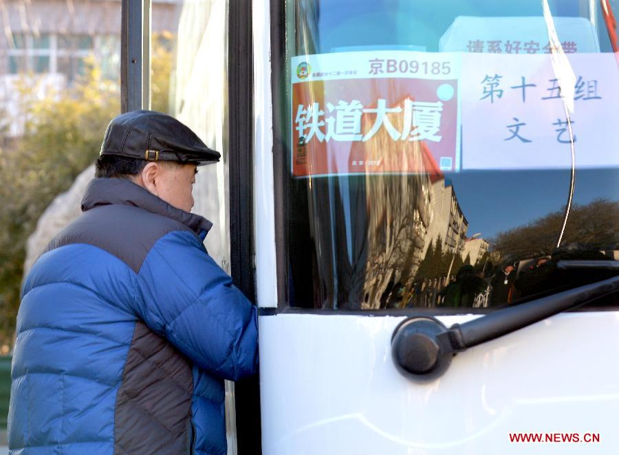 The 2012 Nobel laureate Mo Yan, a member of the 12th National Committee of the Chinese People's Political Consultative Conference (CPPCC), gets on a shuttle bus for a routine meeting of the CPPCC in Beijing, China, March 1, 2013. The first session of the 12th CPPCC National Committee will open on March 3. (Xinhua/Wang Song)