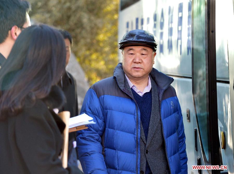 The 2012 Nobel laureate Mo Yan, a member of the 12th National Committee of the Chinese People's Political Consultative Conference (CPPCC), gets on a shuttle bus for a routine meeting of the CPPCC in Beijing, China, March 1, 2013. The first session of the 12th CPPCC National Committee will open on March 3. (Xinhua/Wang Song)