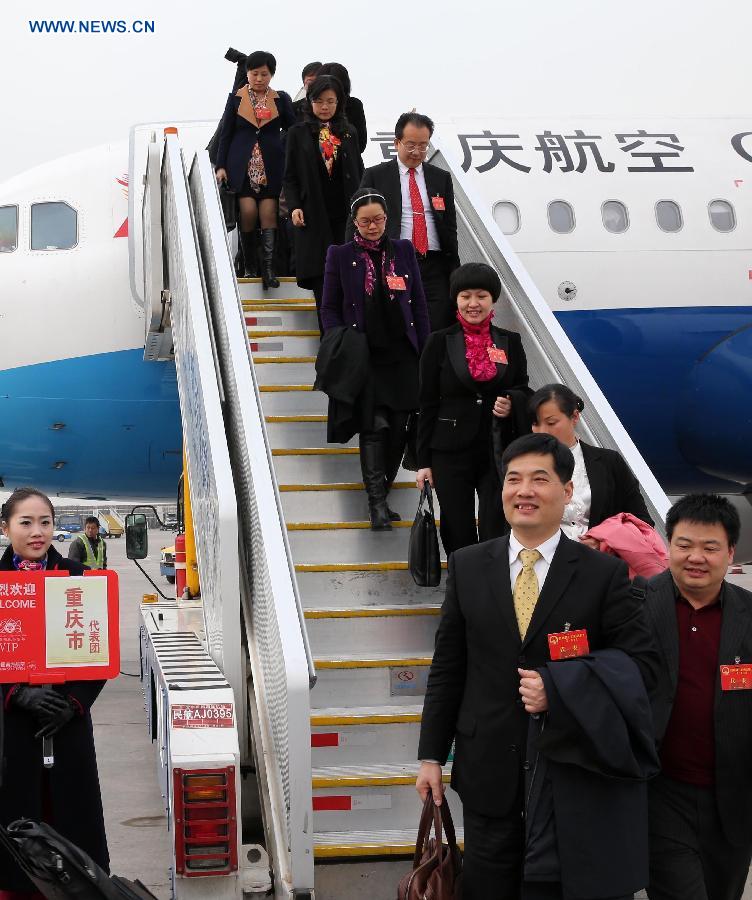 Deputies to the 12th National People's Congress (NPC) from southwest China's Chongqing Municipality arrive in Beijing, capital of China, March 2, 2013. The first session of the 12th NPC is scheduled to open in Beijing on March 5. (Xinhua/Pang Xinglei)