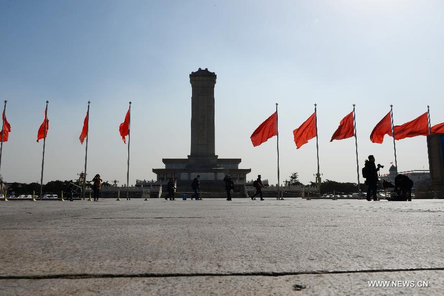 Flags are seen fluttering at Tian'anmen Square in Beijing, capital of China, March 3, 2013. The first session of the 12th National Committee of the Chinese People's Political Consultative Conference (CPPCC) is to open on March 3. (Xinhua/Jin Liangkuai)