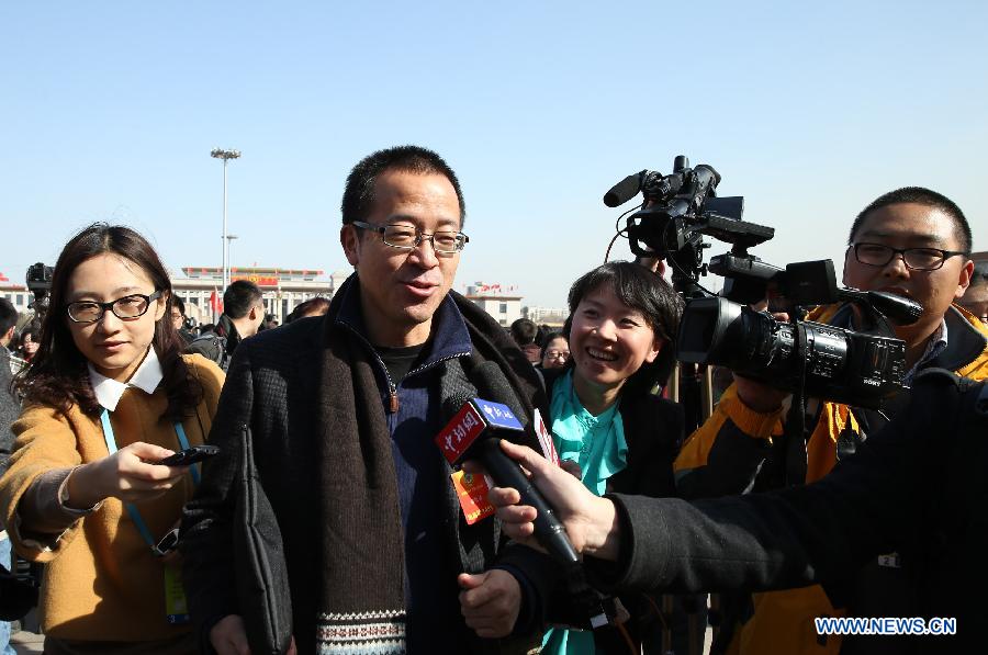 Yu Minhong, a member of the 12th National Committee of the Chinese People's Political Consultative Conference (CPPCC), arrives at the Tian'anmen Square in Beijing, capital of China, March 3, 2013. The first session of the 12th CPPCC National Committee is to open in Beijing on March 3. (Xinhua/Chen Jianli)