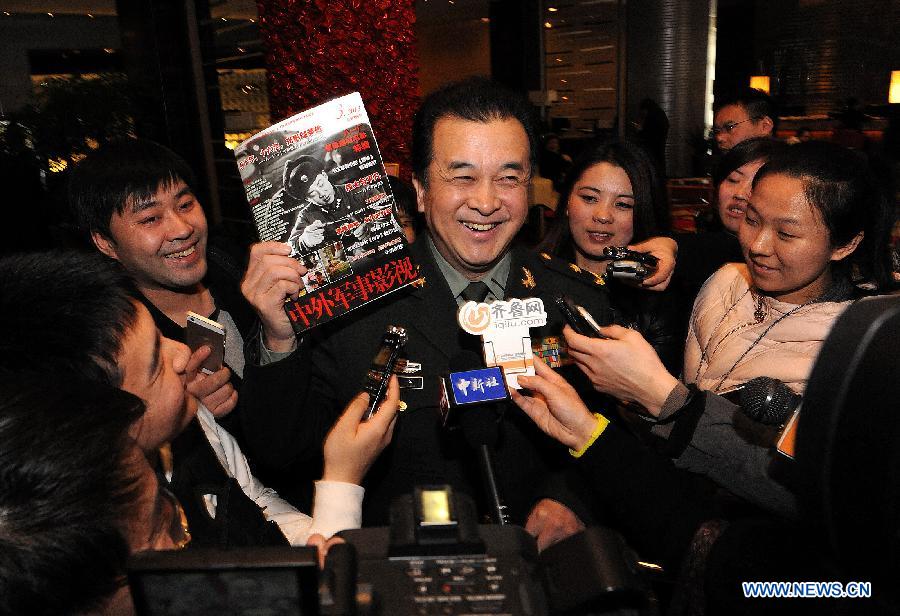 Huang Hong (C), a member of the 12th National Committee of the Chinese People's Political Consultative Conference (CPPCC), receives an interview in the hotel in Beijing, capital of China, March 3, 2013. The first session of the 12th CPPCC National Committee is to open on March 3. (Xinhua/He Junchang)