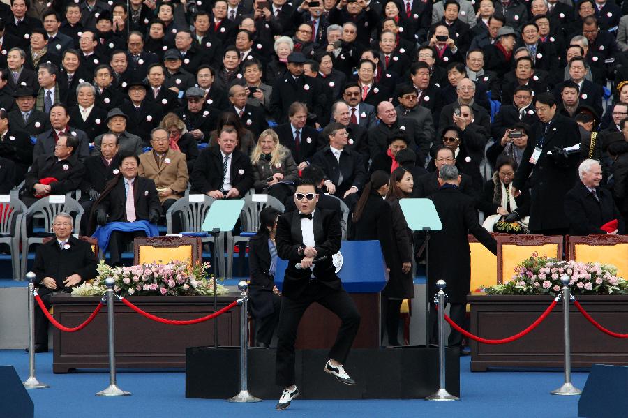 South Korean rapper PSY, third left, performs with dancers before the inauguration ceremony of President Park Geun-hye at the National Assembly in Seoul, South Korea, Monday, Feb. 25, 2013. (Xinhua Photo)