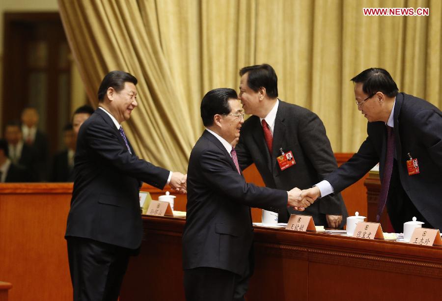 Hu Jintao (R front) and Xi Jinping (L front) shake hands with members of the 12th National Committee of the Chinese People's Political Consultative Conference (CPPCC) during the opening meeting of the first session the 12th CPPCC National Committee at the Great Hall of the People in Beijing, capital of China, March 3, 2013. The first session of the 12th CPPCC National Committee opened here on March 3. (Xinhua/Ju Peng)