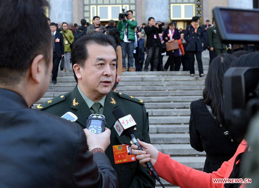 Huang Hong, a member of the 12th National Committee of the Chinese People's Political Consultative Conference (CPPCC), receives interview outside the Great Hall of the People in Beijing, capital of China, March 3, 2013. The first session of the 12th CPPCC National Committee opened in Beijing on March 3. (Xinhua/Wang Song)