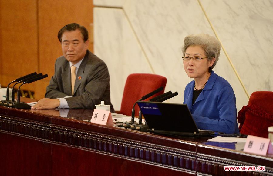 Fu Ying (R), spokesperson for the first session of the 12th National People's Congress (NPC), speaks at the news conference on the first session of the 12th NPC at the Great Hall of the People in Beijing, capital of China, March 4, 2013. (Xinhua/Bi Xiaoyang)