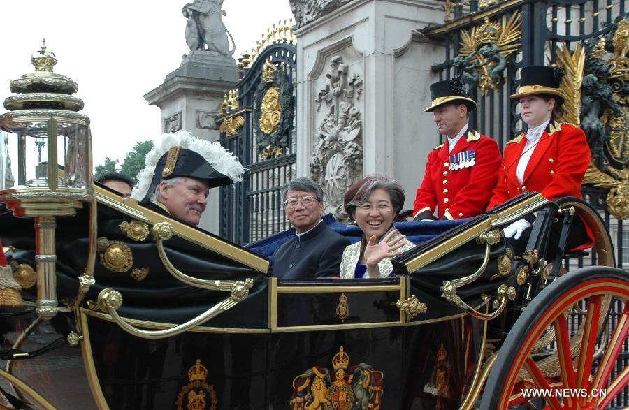 File photo taken on June 12, 2007 shows Fu Ying (3rd R), Chinese Ambassador to the UK, leaves the Buckingham Palace after handing over the letter of credence to the Queen of UK, in London, the UK. Fu Ying debuted at the Great Hall of the People as the spokesperson for the first session of the 12th National People's Congress (NPC) in Beijing, China, March 4, 2013. Born in 1953, the spokesperson was a diplomat of Mongolian ethnic group. Fu had respectively served as the Ambassador to the Philippines, Australia and the UK before she was appointed as Vice minister of Foreign Affairs in 2009. She became the 7th spokesperson of the NPC in March of 2013. (Xinhua)