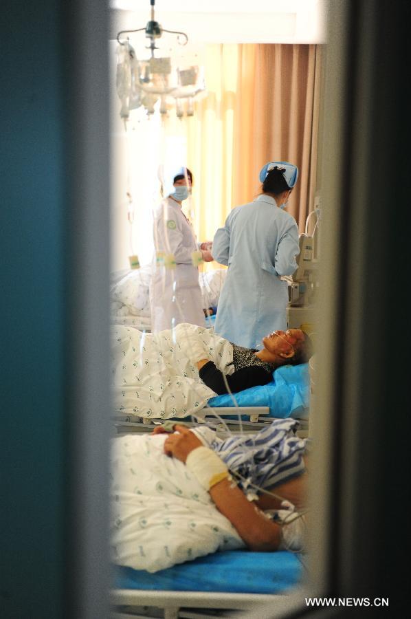 Injured people receive medical treatment in hospital after a gas explosion in an underground shopping street in Shenyang, capital of northeast China's Liaoning Province, March 4, 2013. More than 20 workers were injured in the explosion triggered by a gas leak from underground pipelines at a construction site in the underground shopping street in front of a shopping mall on Monday morning. Some 40 workers were at the scene at the time of the explosion. (Xinhua/Pan Yulong)  