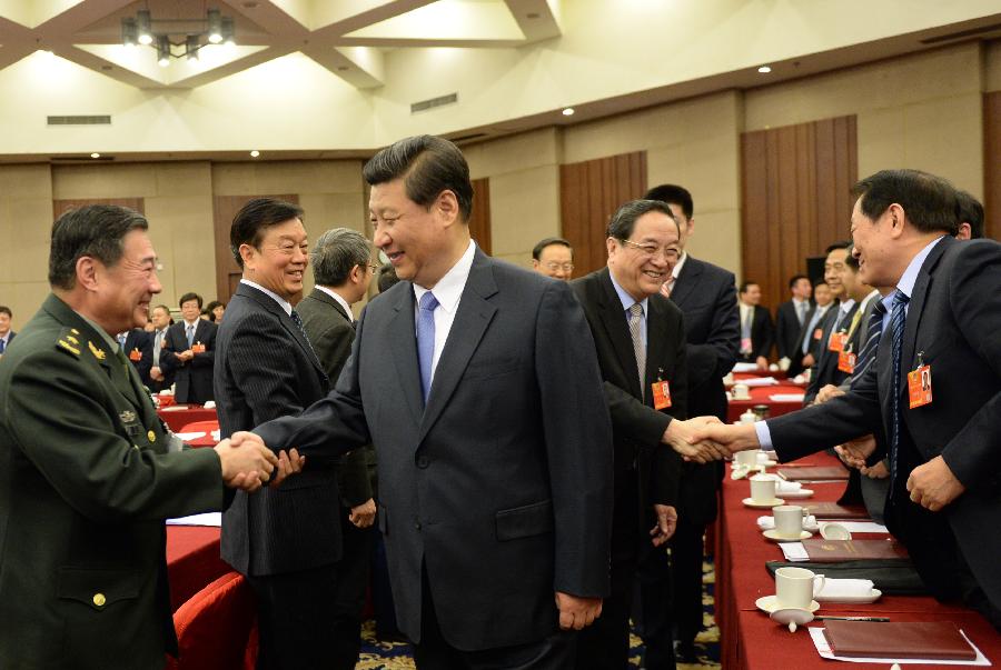 Xi Jinping (R front), general secretary of the Central Committee of the Communist Party of China (CPC) and Chairman of the CPC Central Military Commission, visits members of the 12th National Committee of the Chinese People's Political Consultative Conference (CPPCC) from China Association for Science and Technology as well as science and technology circles and joins their panel discussion in Beijing, capital of China, March 4, 2013. Yu Zhengsheng, a Standing Committee member of the Political Bureau of the CPC Central Committee, who is also the executive chairperson of the presidium of the first session of the 12th CPPCC National Committee, also attended the activity. (Xinhua/Li Xueren)