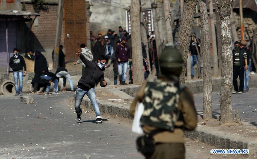Kashmiri protesters throw stones at Indian paramilitary soldiers and police during a protest in Srinagar, summer capital of Indian-controlled Kashmir, March 4, 2013. Tension gripped Muslim majority areas of Indian-controlled Kashmir on Monday following the death of a Kashmiri student in Indian state of Andhra Pradesh. (Xinhua/Javed Dar) 