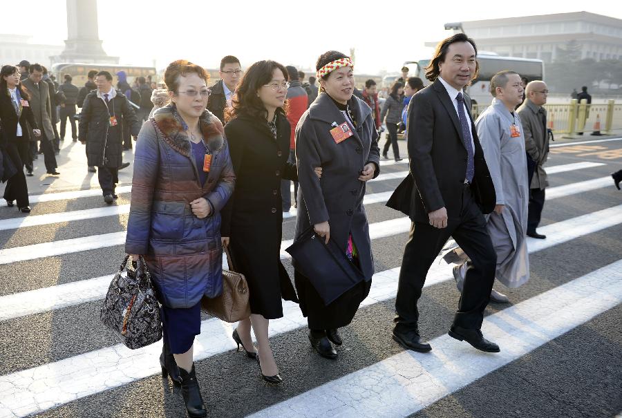 Deputies to the first session of the 12th National People's Congress (NPC) arrive at Tian'anmen Square in Beijing, capital of China, March 5, 2013. The first session of the 12th National People's Congress (NPC) will open at the Great Hall of the People in Beijing on March 5. (Xinhua/Wang Peng) 