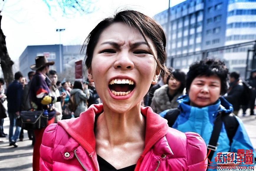 A candidate who failed to pass the preliminary exam of Beijing Film Academy (BFA) bursts into tears on Feb. 26, 2013. 70 percent of the candidates were eliminated in the first test of BFA.