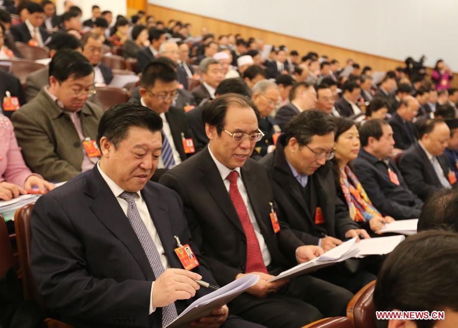 Members of the 12th National Committee of the Chinese People's Political Consultative Conference (CPPCC) attend the opening the meeting of the first session of the 12th National People's Congress (NPC) at the Great Hall of the People in Beijing, capital of China, March 5, 2013. (Xinhua/Li Xueren) 