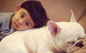 Cute Japanese boy and his beloved bulldog 