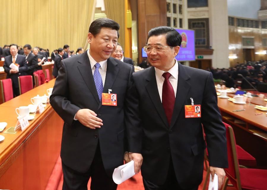 Hu Jintao (R, front) talks with Xi Jinping after the opening meeting of the first session of the 12th National People's Congress (NPC) at the Great Hall of the People in Beijing, capital of China, March 5, 2013. The first session of the 12th NPC opened in Beijing on March 5. (Xinhua/Lan Hongguang)