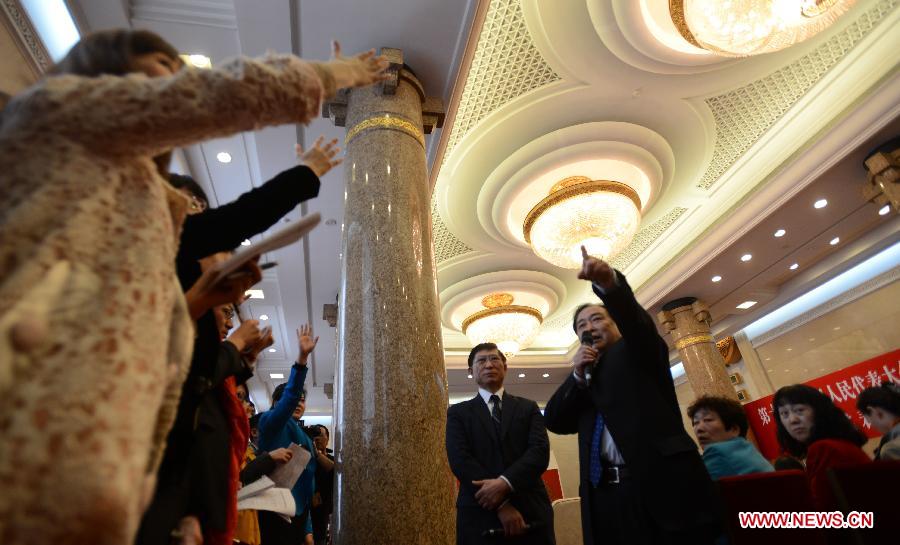 Journalists raise hands to ask questions at a panel discussion of deputies to the 12th National People's Congress (NPC) from northeast China's Liaoning Province, in Beijing, capital of China, March 5, 2013. A panel discussion of the Liaoning delegation to the first session of the 12th NPC was open to media on Tuesday. (Xinhua/Wang Jianhua)