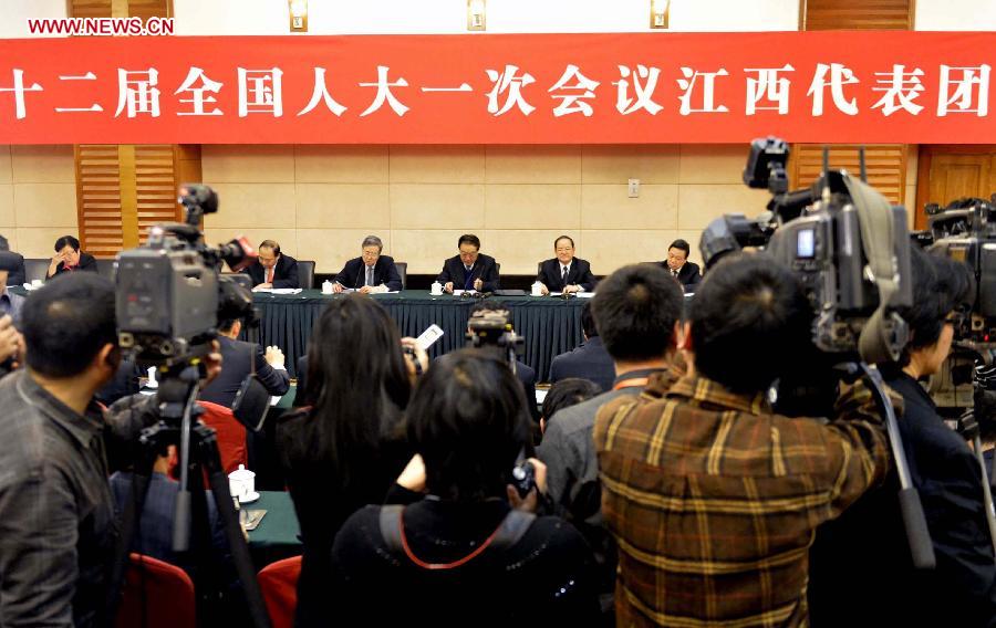 Deputies to the 12th National People's Congress (NPC) from east China's Jiangxi Province take part in a panel discussion in Beijing, capital of China, March 5, 2013. A panel discussion of the Jiangxi delegation to the first session of the 12th NPC was open to media on Tuesday. (Xinhua/Yang Zongyou)