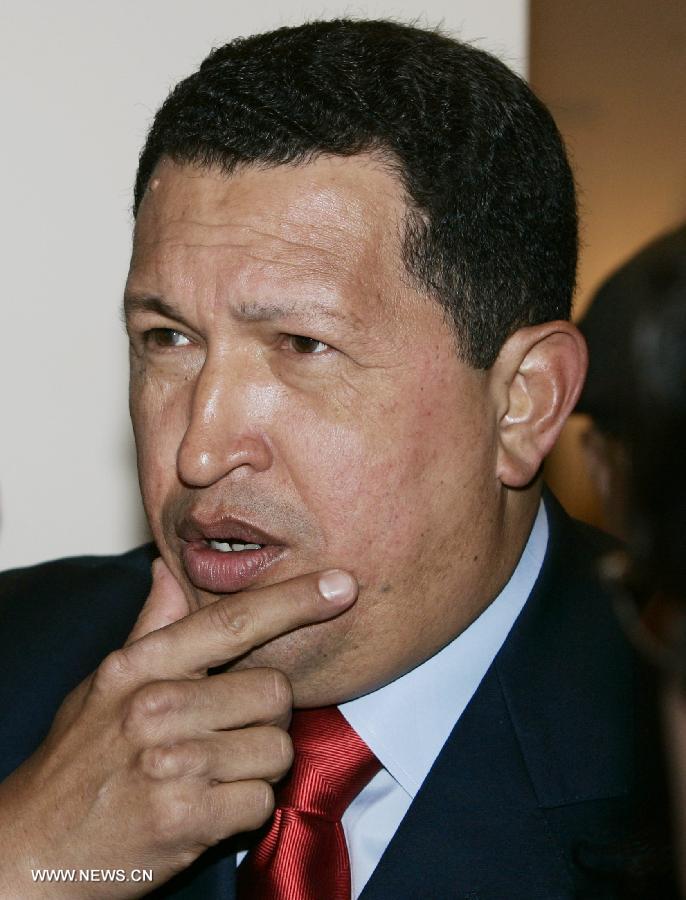 File photo taken on Nov. 4, 2005 shows Venezuelan President Hugo Chavez listening to questions at the 4th Summit of the Americas in Mar del Plata, Argentina. Venezuelan government confirmed President Hugo Chavez's death on March 5, 2013. (Xinhua) 