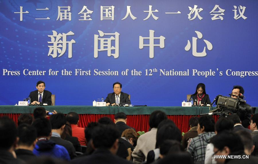 Zhang Ping (2nd L), minister of the National Development and Reform Commission, answers questions at a press conference of the first session of the 12th National People's Congress (NPC) in Beijing, capital of China, March 6, 2013. (Xinhua/Wang Peng)