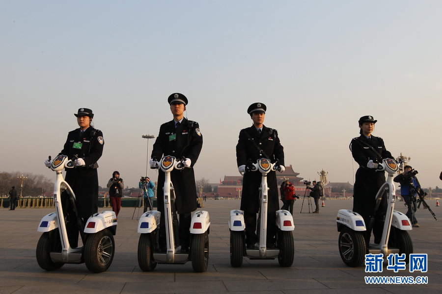 Policemen patrol on Tiananmen Square riding Segways.(Xinhua)