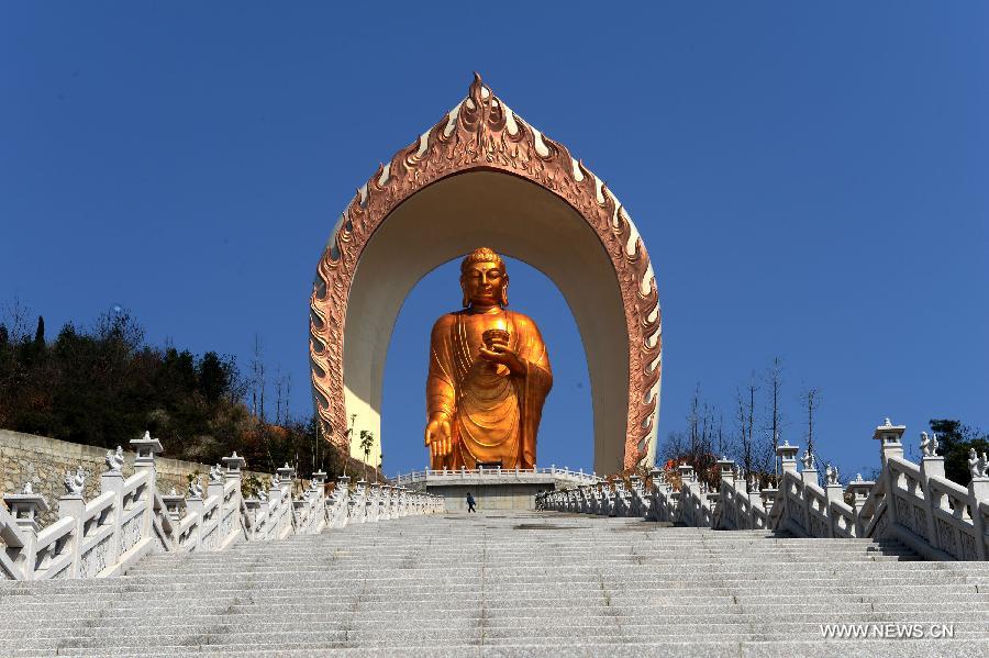 The Donglin Buddha statue is seen at the Donglin Temple in Xingzi County of Jiujiang City, east China's Jiangxi Province, March 6, 2013. The bronze statue of Amitabha Buddha, which is 48 meters in height, is believed to be the tallest of its kind in the world. The project, with the total cost of about 1 billion yuan (161 million U.S. dollars), has been basically completed. It was totally funded by private donations. (Xinhua/Song Zhenping)  