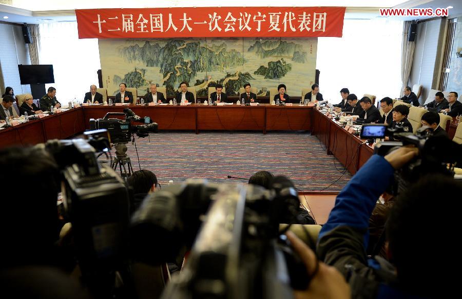 Deputies to the 12th National People's Congress (NPC) from northwest China's Ningxia Hui Autonomous Region take part in a discussion in Beijing, capital of China, March 6, 2013. The discussion which was held by the Ningxia delegation to the first session of the 12th NPC was open to media on Wednesday. (Xinhua/Wang Peng)