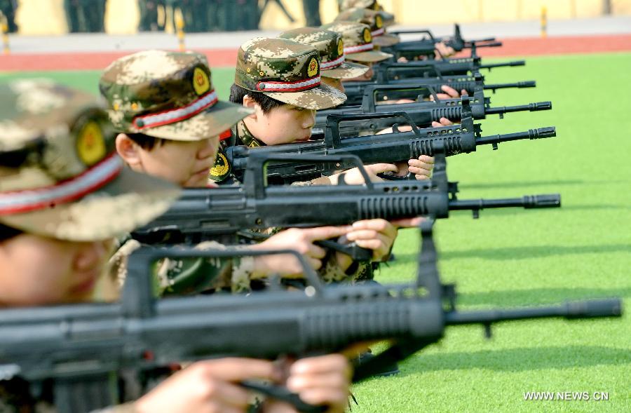 Newly-recruited female soldiers of the Border Control Corps of Hebei Public Security receive military training in Shijiazhuang, capital of north China's Hebei Province, March 6, 2013. (Xinhua/Yang Shiyao)