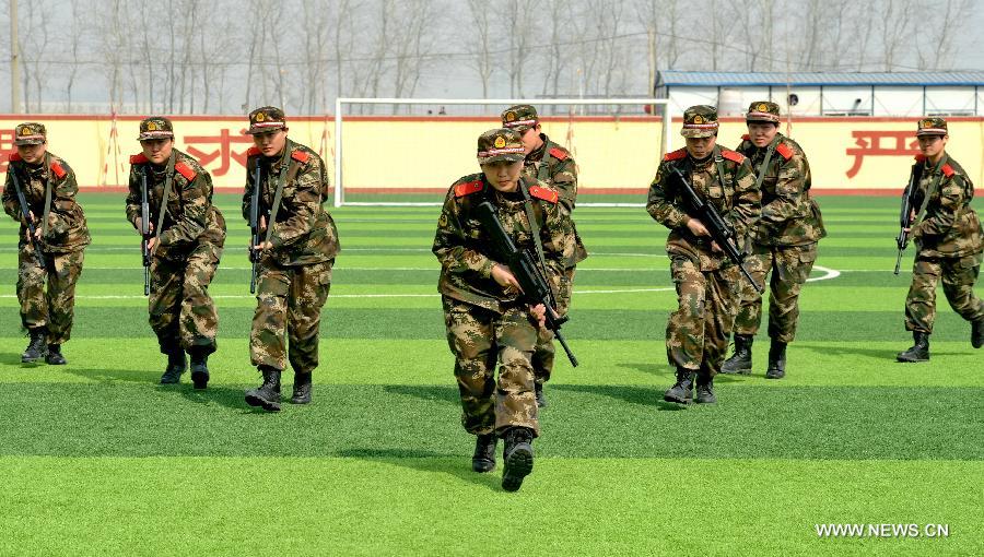 Newly-recruited female soldiers of the Border Control Corps of Hebei Public Security receive military training in Shijiazhuang, capital of north China's Hebei Province, March 6, 2013. (Xinhua/Yang Shiyao)  