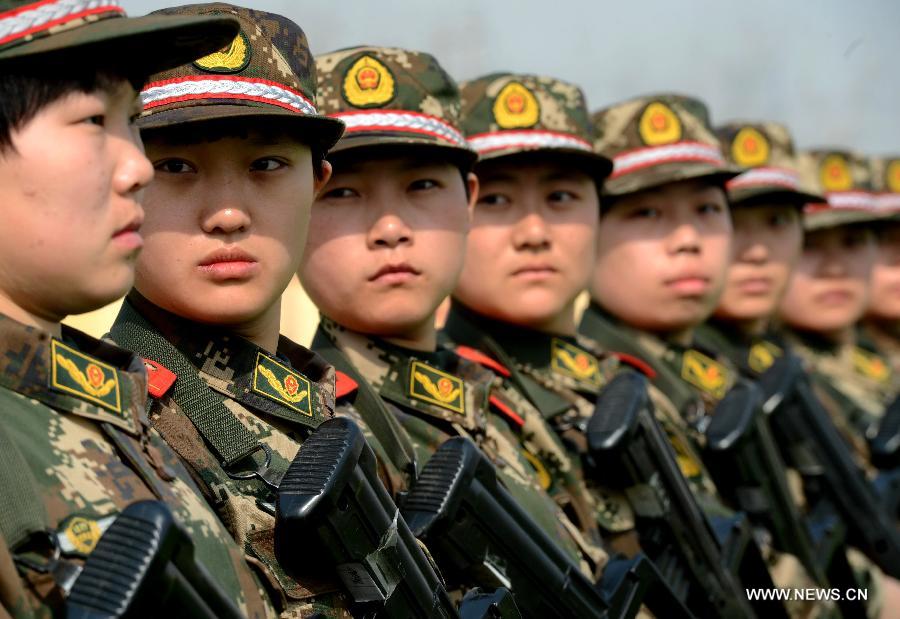 Newly-recruited female soldiers of the Border Control Corps of Hebei Public Security receive military training in Shijiazhuang, capital of north China's Hebei Province, March 6, 2013. (Xinhua/Yang Shiyao)