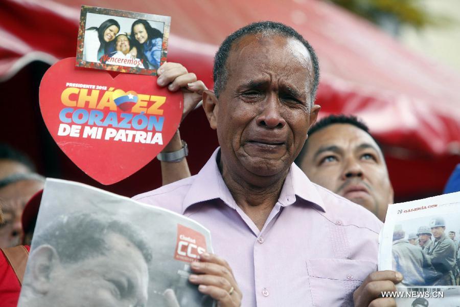 A man reacts at Plaza Bolivar of Caracas, in Caracas, capital of Venezuela, on March 6, 2013. On Tuesday afternoon, Venezuelan President, Hugo Chavez, died after fighting for almost two years with a cancer disease. The body of Chavez will be moved from the health center to the Military Academy in southern Caracas, inside Tiuna's Fort. (Xinhua/AVN)