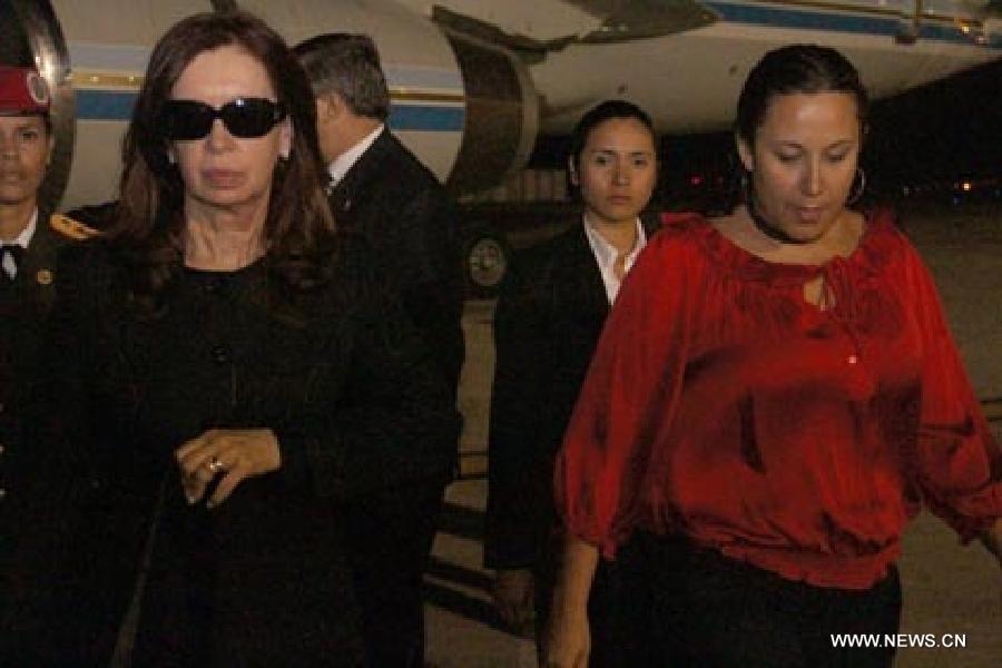 Image provided by People's Ministry of Foreign Affairs of Venezuela, shows Argentine President Cristina Fernandez (L), arriving at Caracas city, capital of Venezuela, on March 6, 2013. Venezuelan President Hugo Chavez died of cancer on March 5. (Xinhua/People's Ministry of Foreign Affairs of Venezuela)